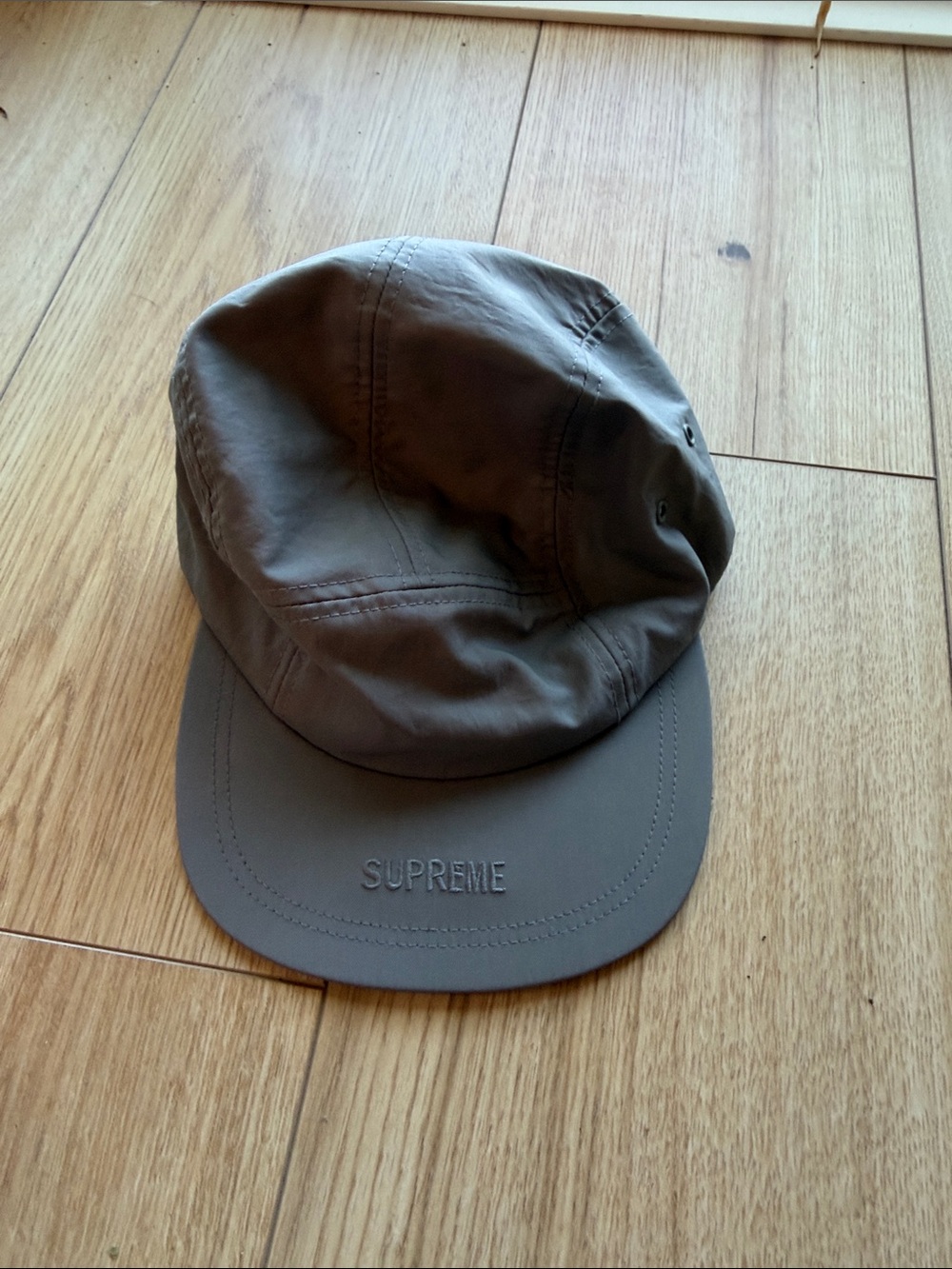 Supreme Gray 5-Panel reflecting hat.